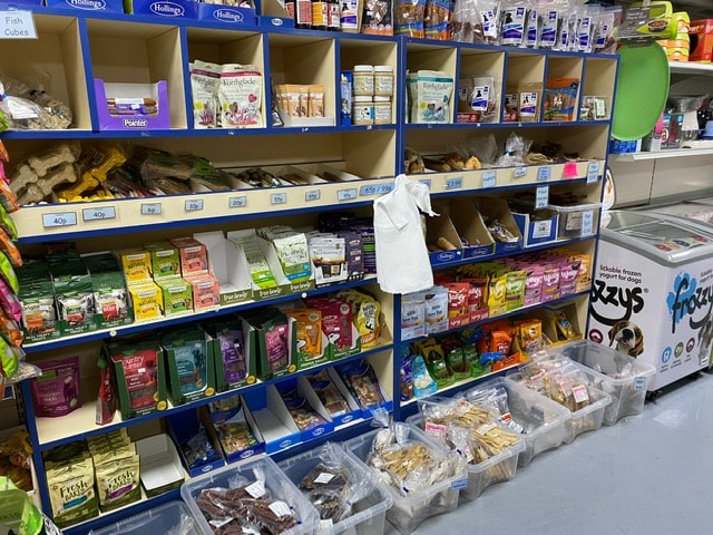 Full shelves of various dog food